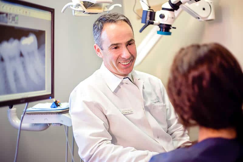 Dr. Yuri Shamritsky speaking with a patient photo